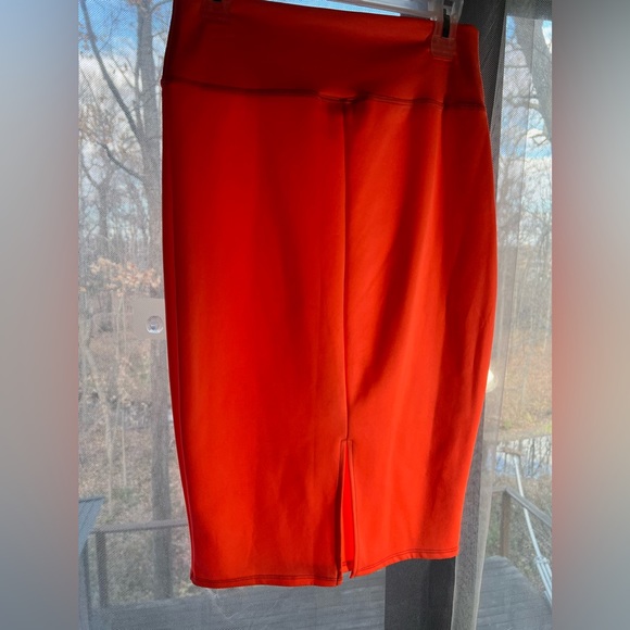 I’m in love with Derek hot orange pencil skit with opening in the back. Size L - Picture 5 of 6